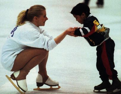 [Tonya skating with a kid]